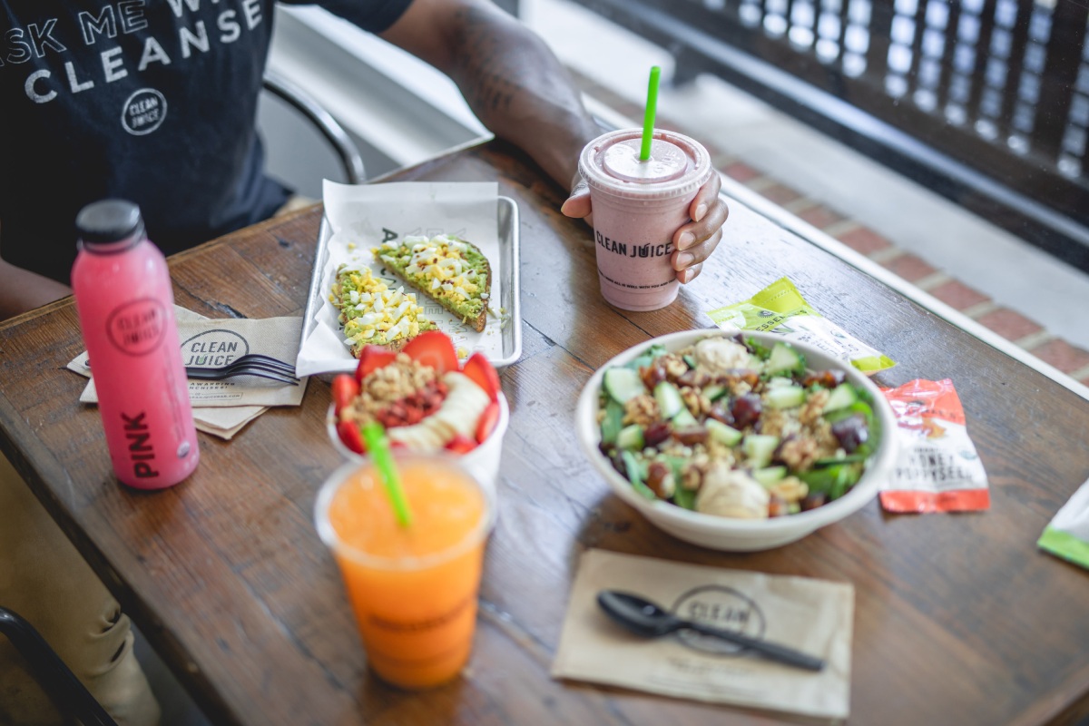Table with Juices and Healthy Lunch at Clean Juice