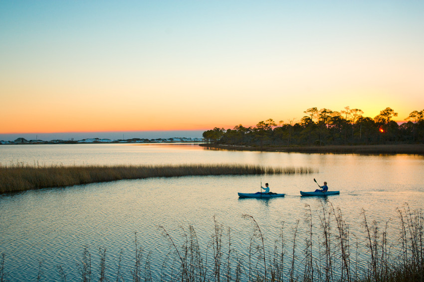Kayakers at Sunset on a Coastal Dune Lake