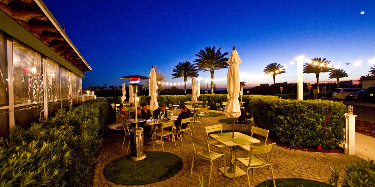 Outdoor Dining Tables with String Lights at George's in Alys Beach